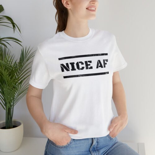 A young woman wearing a white Funny T-Shirt saying "Nice AF" in distressed letters.