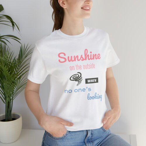 Funny T-Shirt featuring a picture of a little hurricane and saying "Sunshine on the outside, hurricane when no one's looking". White color