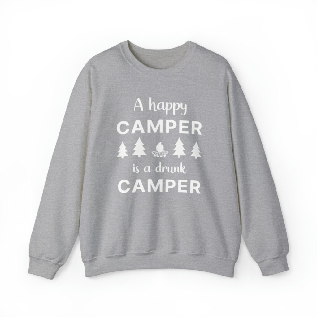 A gray Funny sweatshirt with an illustration of fur trees and a campfire saying "A happy camper is a drunk camper".