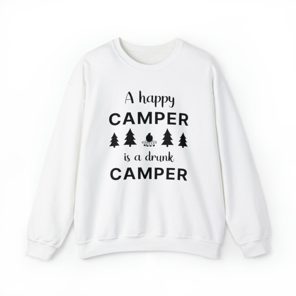 A white Funny sweatshirt with an illustration of fur trees and a campfire saying "A happy camper is a drunk camper".
