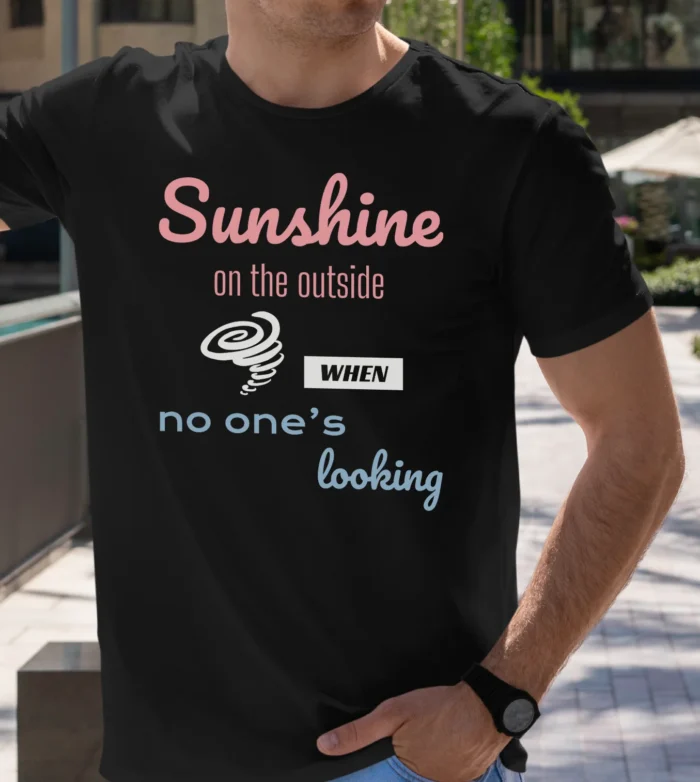 Funny T-Shirt featuring a picture of a little hurricane and saying "Sunshine on the outside, hurricane when no one's looking". Black color