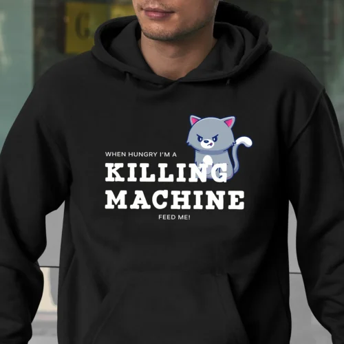 Funny hoodie for Cat Lovers featuring a picture of a funny angry cat and saying "When hungry, I'm a killing machine. Feed me!" Black color