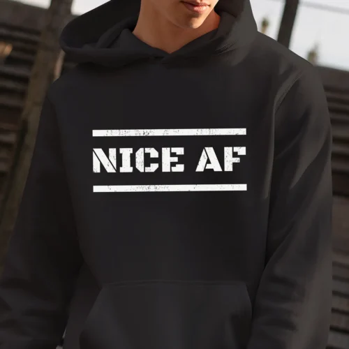 A man outside wearing a black Funny hoodie saying "Nice AF".