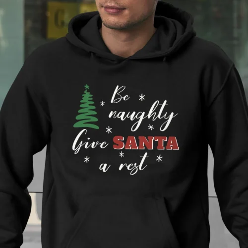 A Funny Christmas hoodie with a green Christmas tree, the hoodie is saying "be naughty, give Santa a rest", black color