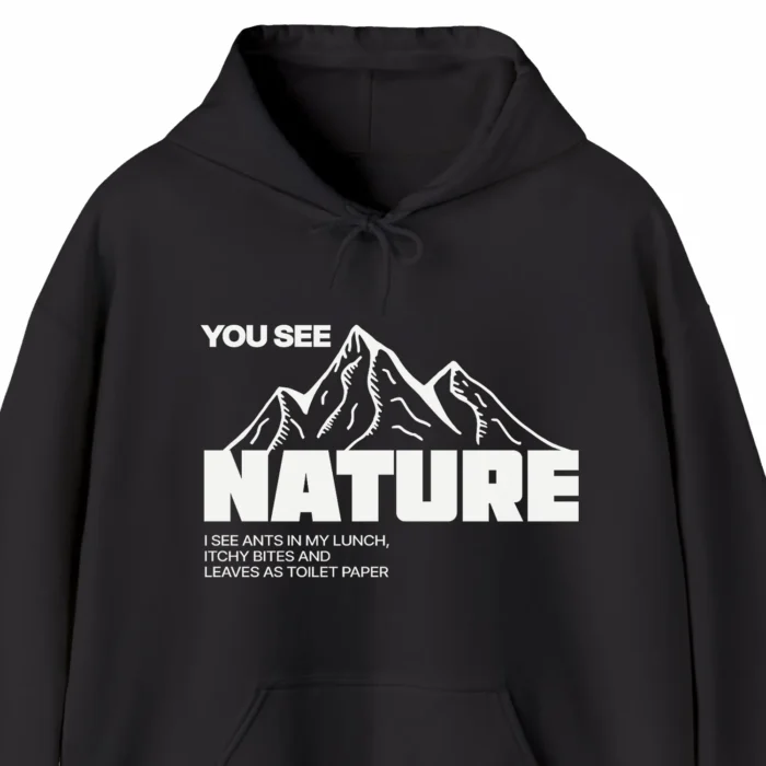 A funny hoodie for campers with a picture of mountains, saying "You see nature, I see ants in my lunch, itchy bites and leaves as toilet paper" black color