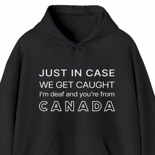 A funny hoodie saying "In case we get caught I'm deaf and you're from Canada", black color