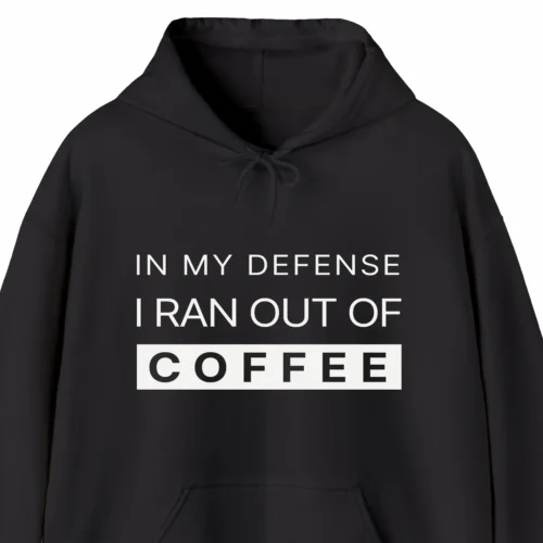 A funny hoodie saying "In my defense, I ran out of coffee", black color