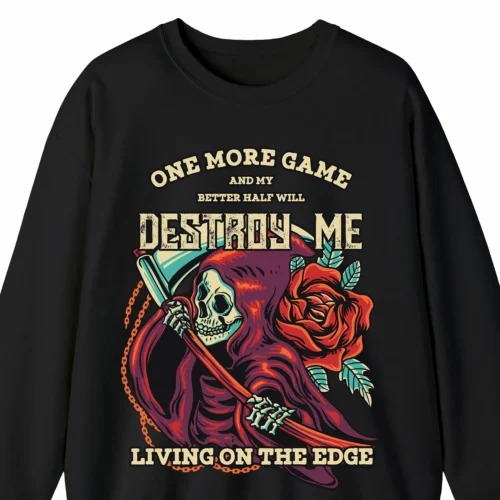 A funny sweatshirt for video gamers with a picture of death with a scythe, saying "One more game and my better half will destroy me. Living on the edge" black color