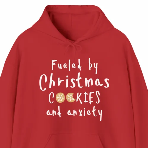 A Funny Christmas hoodie with cookies, the hoodie says "Fueled by Christmas cookies and anxiety", red color