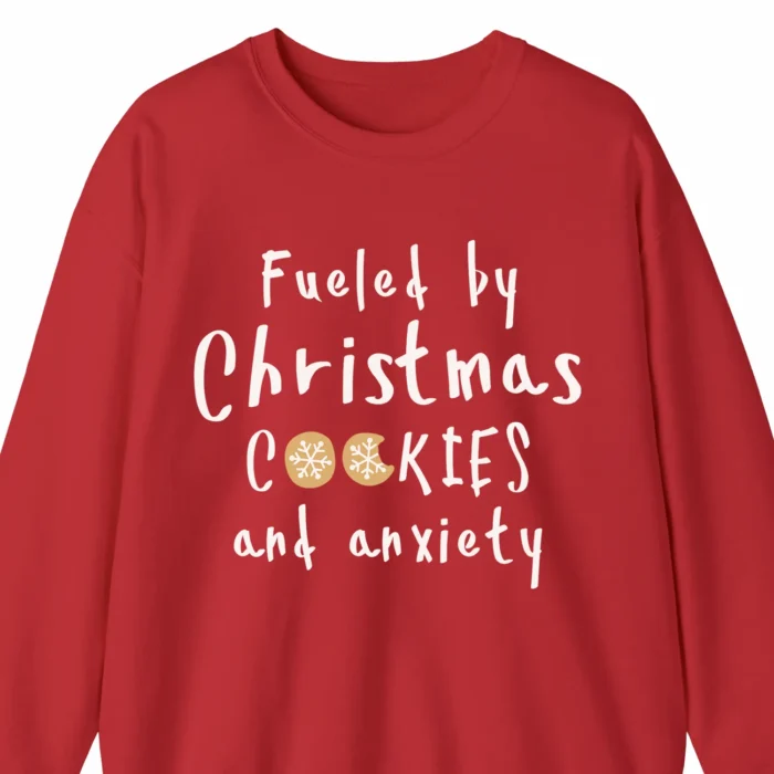 A Funny Christmas sweatshirt with cookies, the sweatshirt says "Fueled by Christmas cookies and anxiety", red color
