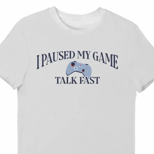 A funny t-shirt for video gamers, saying "I Paused My Video Game, Talk Fast", white color