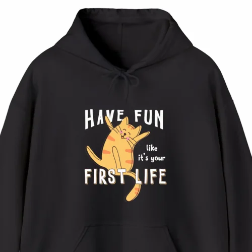 A funny hoodie with a picture of a cute cat, saying "Have fun like it's your first life", black