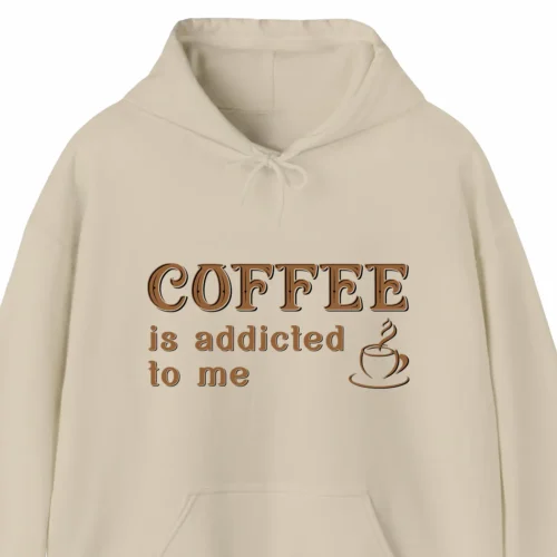 A funny hoodie saying "Coffee is addicted to me", sand color