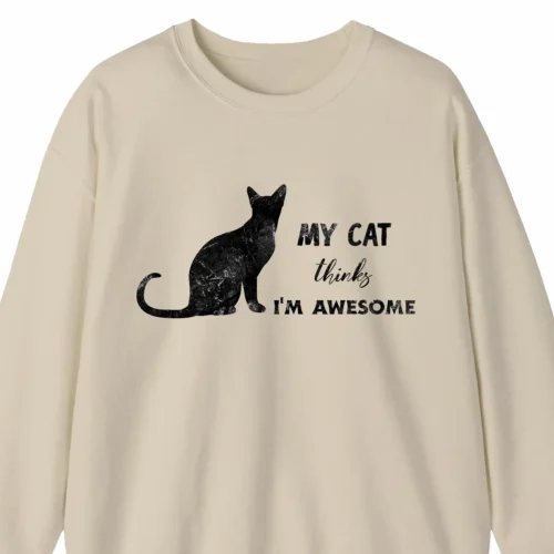 A funny sweatshirt saying "My cat thinks I'm awesome", sand