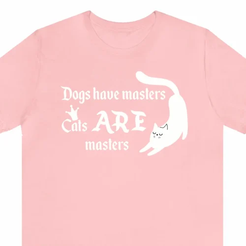 A funny t-shirt with a picture of a cute cat saying "Dogs have masters. Cats ARE masters", pink color