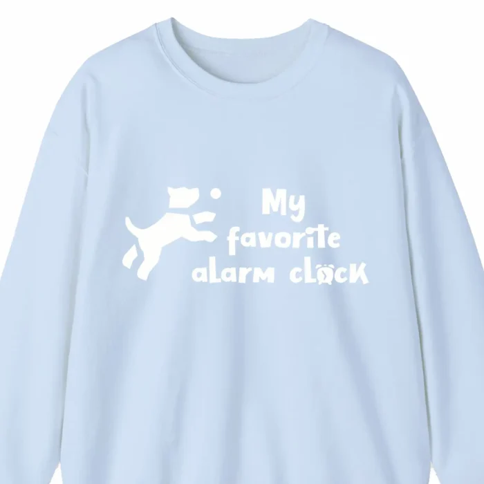 A funny hoodie with a picture of a cute cartoony dog saying "My favorite alarm clock", baby blue color
